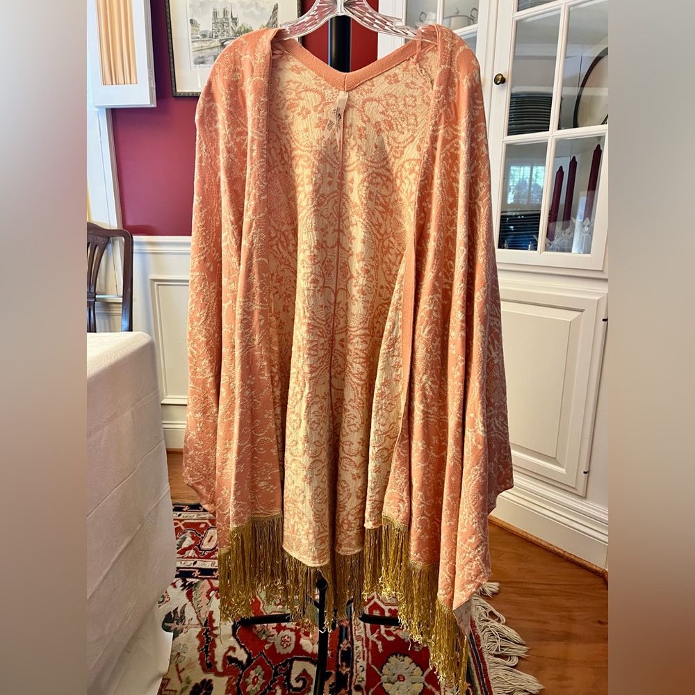 Melissa McCarthy Pink and Gold Poncho